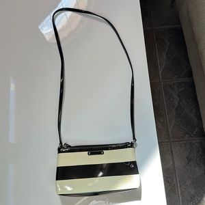 Black and cream Kate Spade shoulder bag. A little scuffing on the bag of the bag